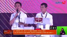 Pasangan Calon Bupati dan Wakil Bupati Konawe Utara, Nomor Urut Satu, Ikbar-Abuhaera pada Debat Publik Pemilihan Tahun 2024, di Gor Konasara, Sabtu malam (26/10/2024).
