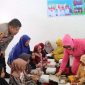 Pembagian makanan bergizi gratis kepada siswa TK Negeri Pertiwi, Kelurahan Saraea. Rabu, (17/01/2025).